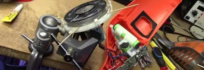 Vacuum cleaner repair parts and tools on a workbench in Boulder, CO